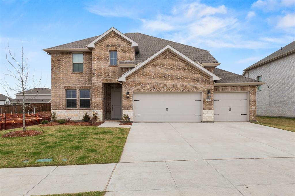 1926 Honey Crk Road Forney, TX 75126 - Photo 2 of 29 a front view of a house with a yard and garage
