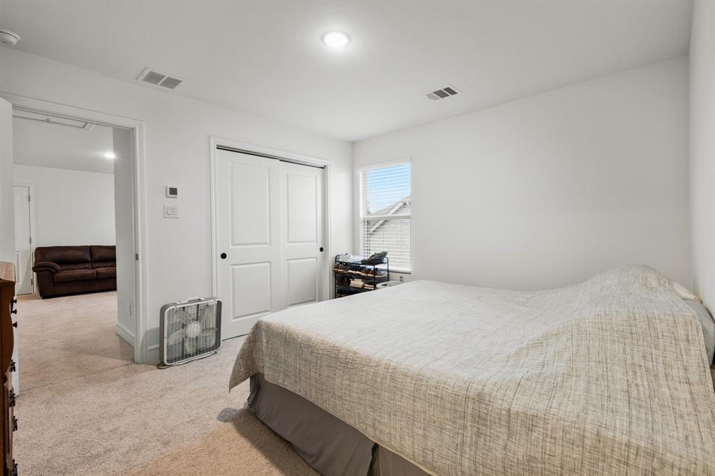 1926 Honey Crk Road Forney, TX 75126 - Photo 23 of 29 a bedroom with a bed and a large mirror