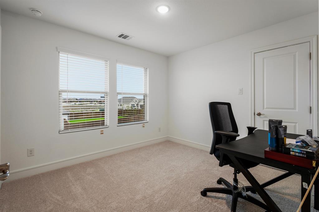 1926 Honey Crk Road Forney, TX 75126 - Photo 24 of 29 a view of a workspace with furniture and a window