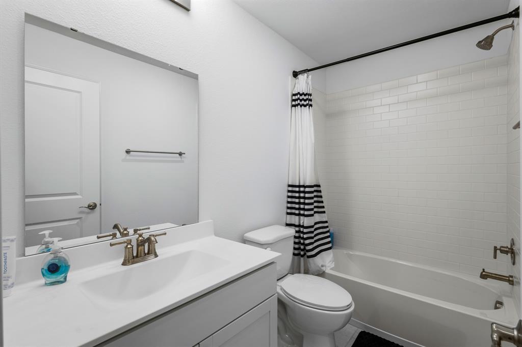 1926 Honey Crk Road Forney, TX 75126 - Photo 27 of 29 a bathroom with a sink toilet and shower