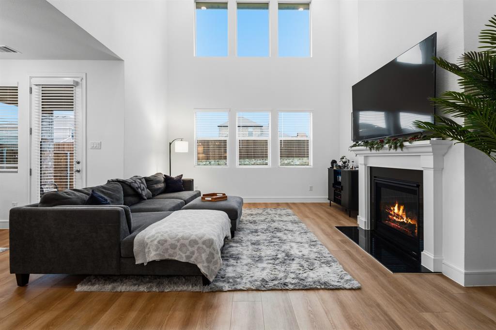 1926 Honey Crk Road Forney, TX 75126 - Photo 6 of 29 a living room with furniture and a fireplace