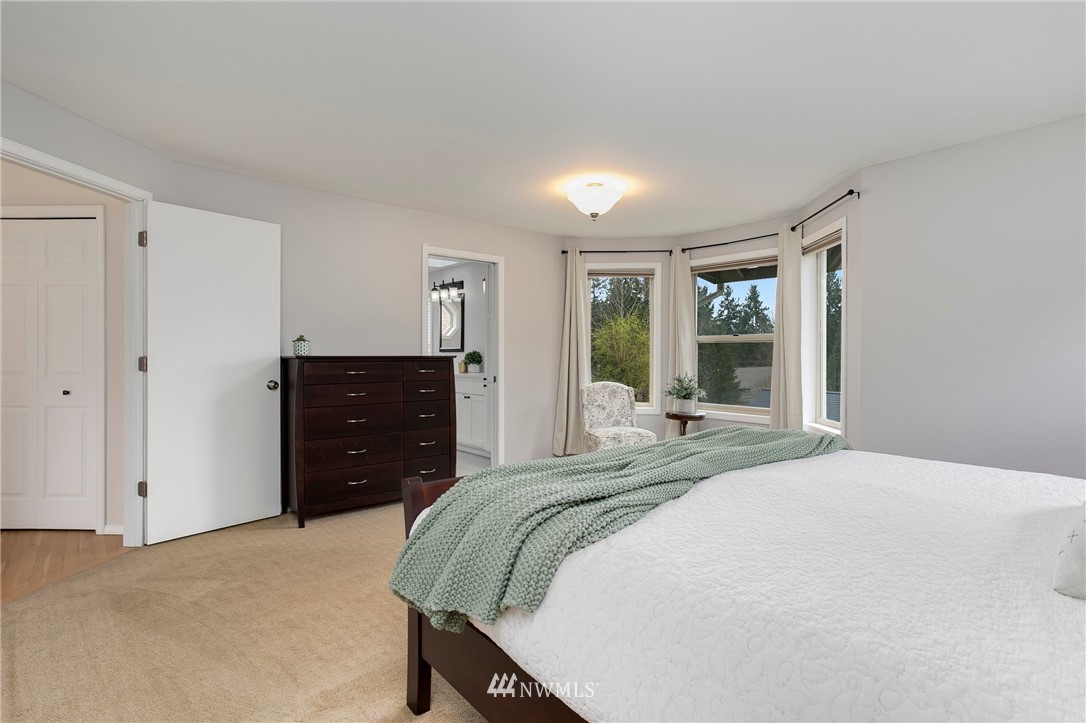 4521 244th Street Southeast Bothell, WA 98021 - Photo 13 of 38 a bedroom with a bed and window