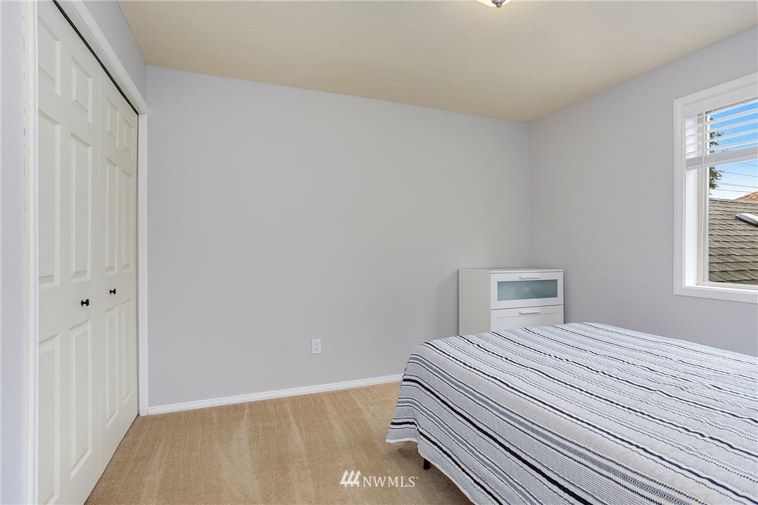 4521 244th Street Southeast Bothell, WA 98021 - Photo 17 of 38 a bedroom with a bed and a window