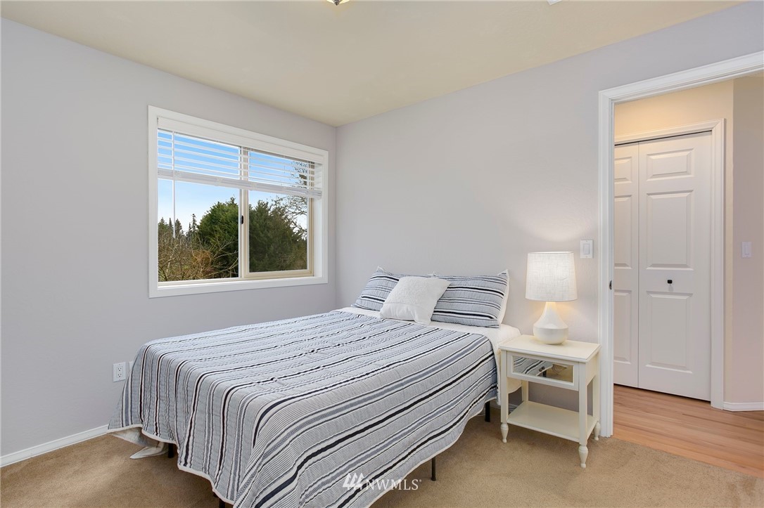 4521 244th Street Southeast Bothell, WA 98021 - Photo 18 of 38 a bedroom with a bed and a window