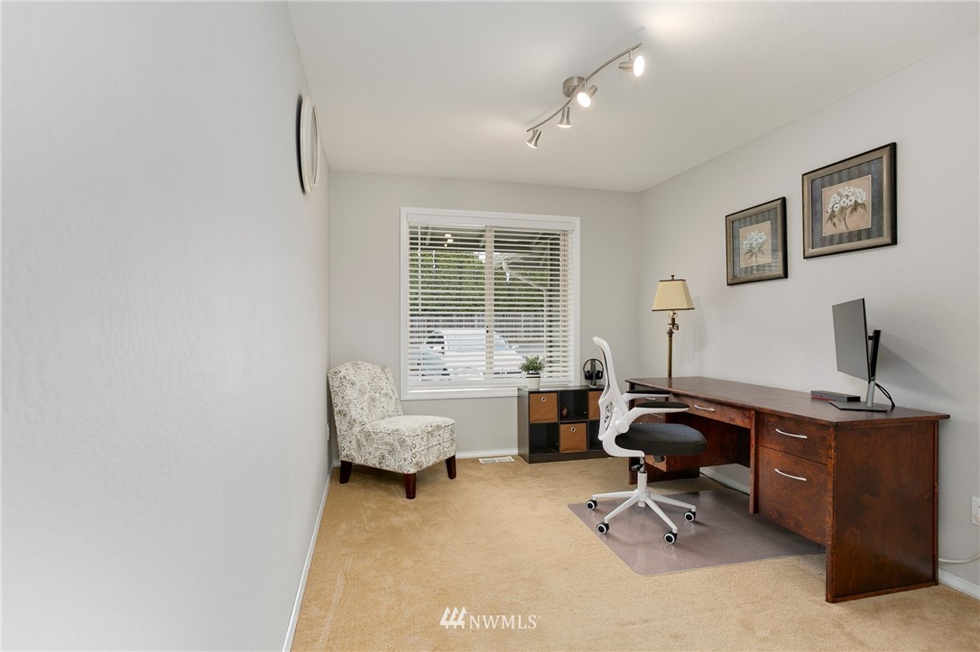 4521 244th Street Southeast Bothell, WA 98021 - Photo 20 of 38 a view of a workspace with furniture and a window