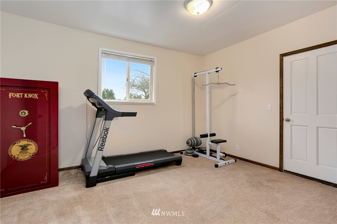 4521 244th Street Southeast Bothell, WA 98021 - Photo 22 of 38 a room with gym equipment and a window