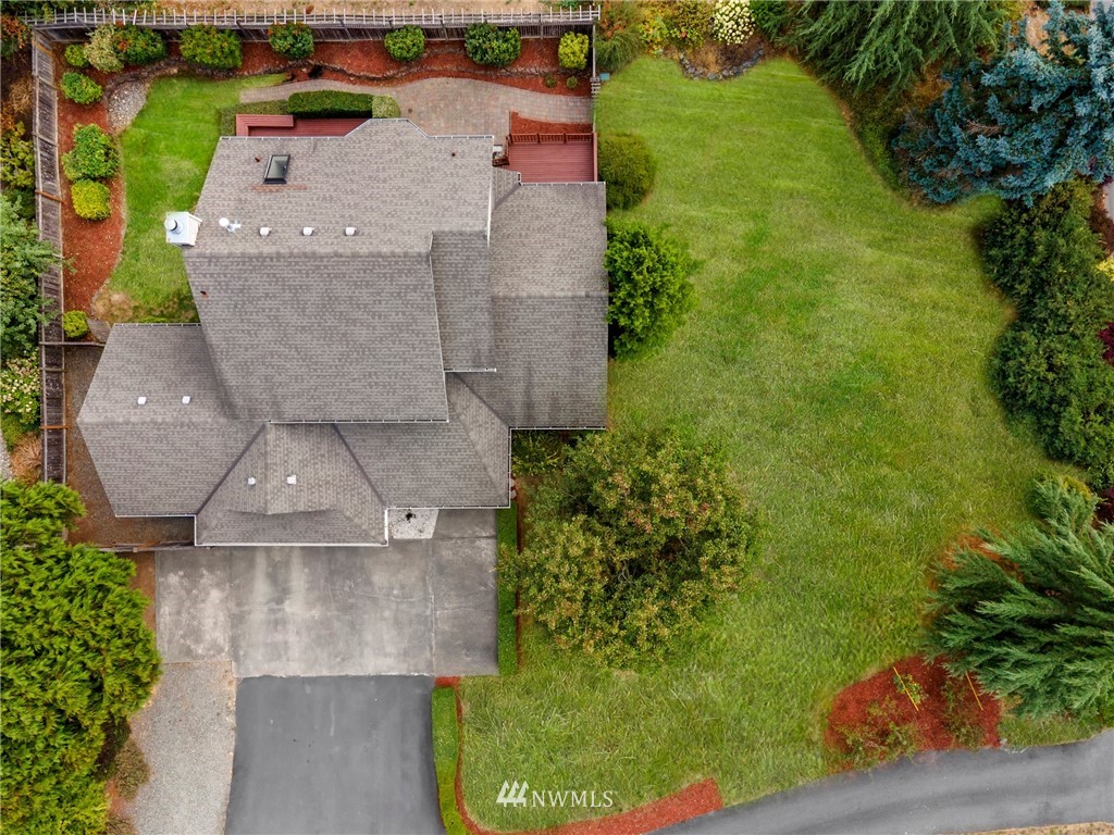 4521 244th Street Southeast Bothell, WA 98021 - Photo 28 of 38 an aerial view of a house with a yard and garden