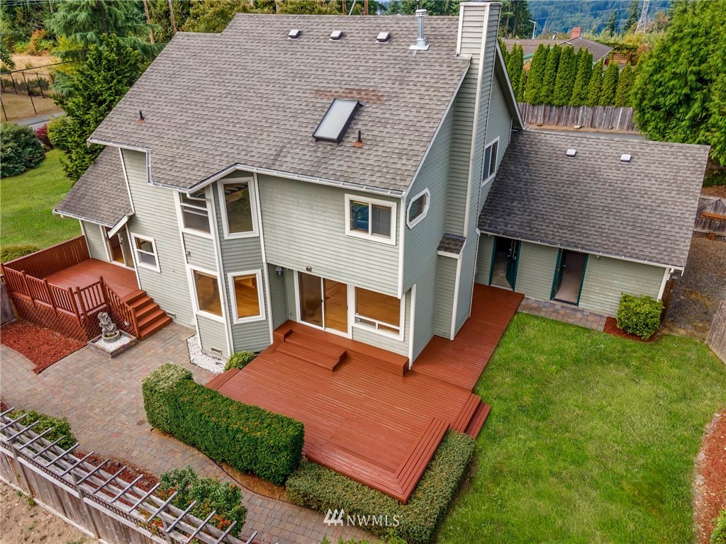 4521 244th Street Southeast Bothell, WA 98021 - Photo 30 of 38 a aerial view of a house with a yard deck and a large tree