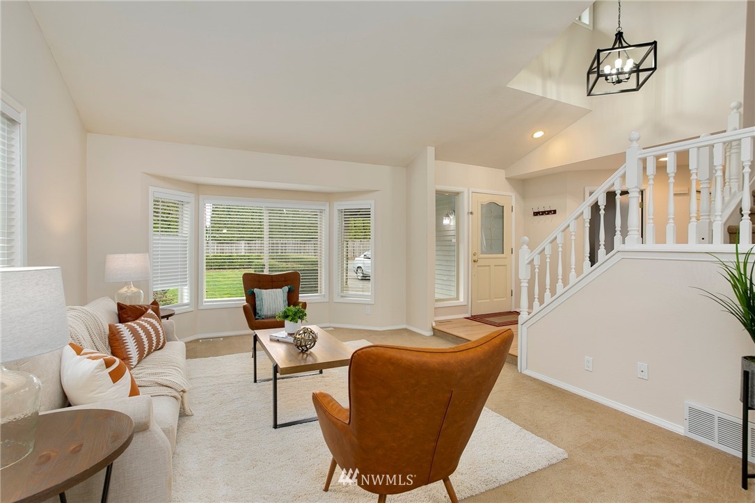4521 244th Street Southeast Bothell, WA 98021 - Photo 3 of 38 a living room with furniture two window and wooden floor