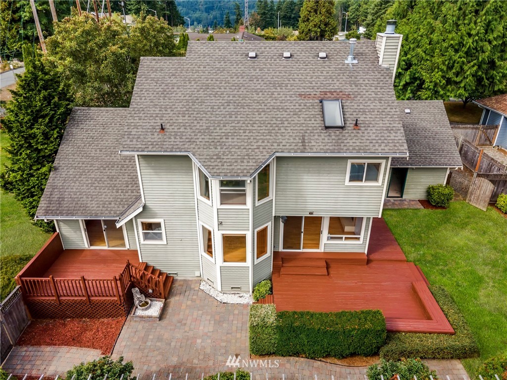 4521 244th Street Southeast Bothell, WA 98021 - Photo 31 of 38 an aerial view of a house with swimming pool and a yard