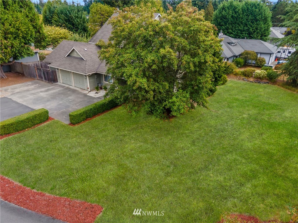 4521 244th Street Southeast Bothell, WA 98021 - Photo 35 of 38 a view of house with a yard