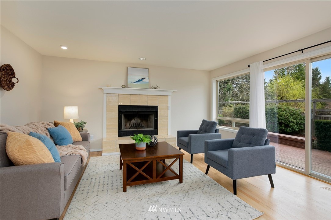 4521 244th Street Southeast Bothell, WA 98021 - Photo 8 of 38 a living room with furniture and a fireplace