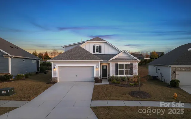 a front view of a house with garage