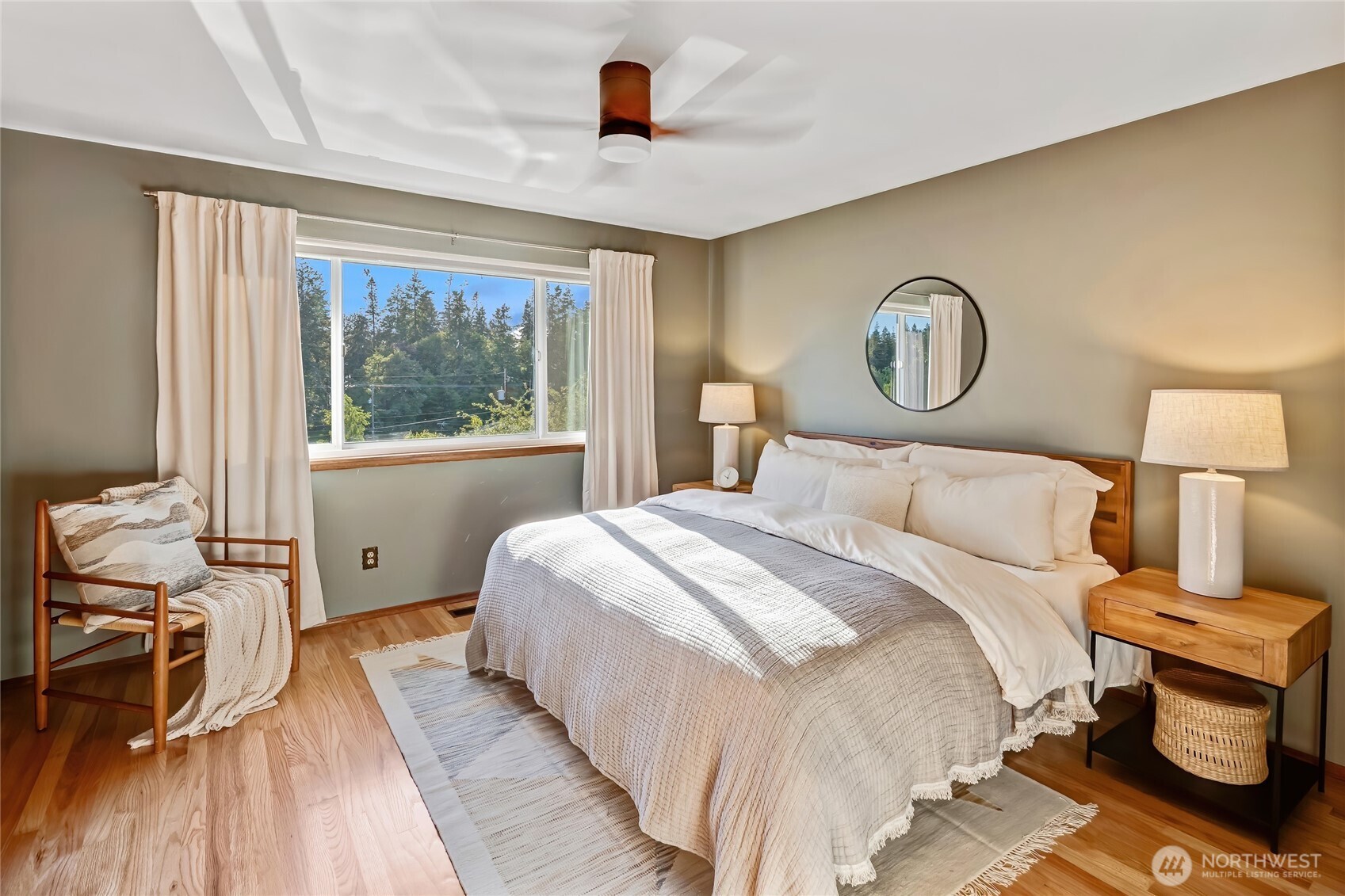 7571 45th Avenue Southwest Seattle, WA 98136 - Photo 24 of 40 a bedroom with a bed and a chandelier