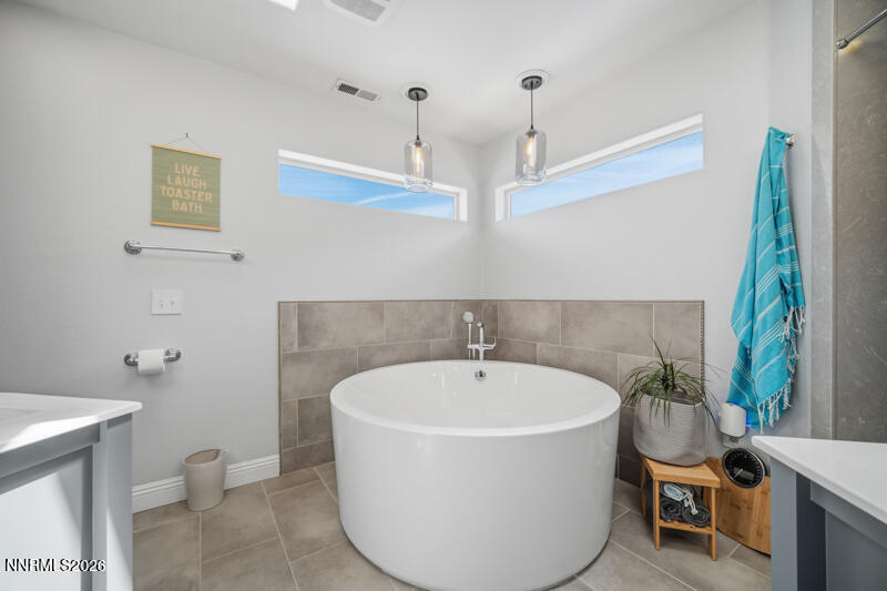 1931 Lousetown Road Reno, NV 89521 - Photo 16 of 51 a white bath tub sitting next to a white toilet