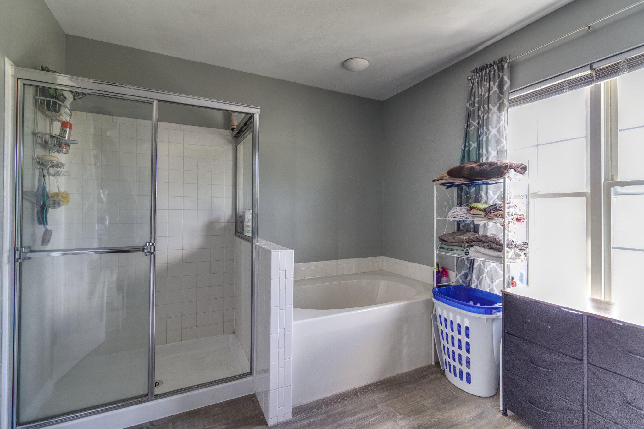 215 Seamaster Road Essex, MD 21221 - Photo 22 of 40 a bathroom with a tub and a shower