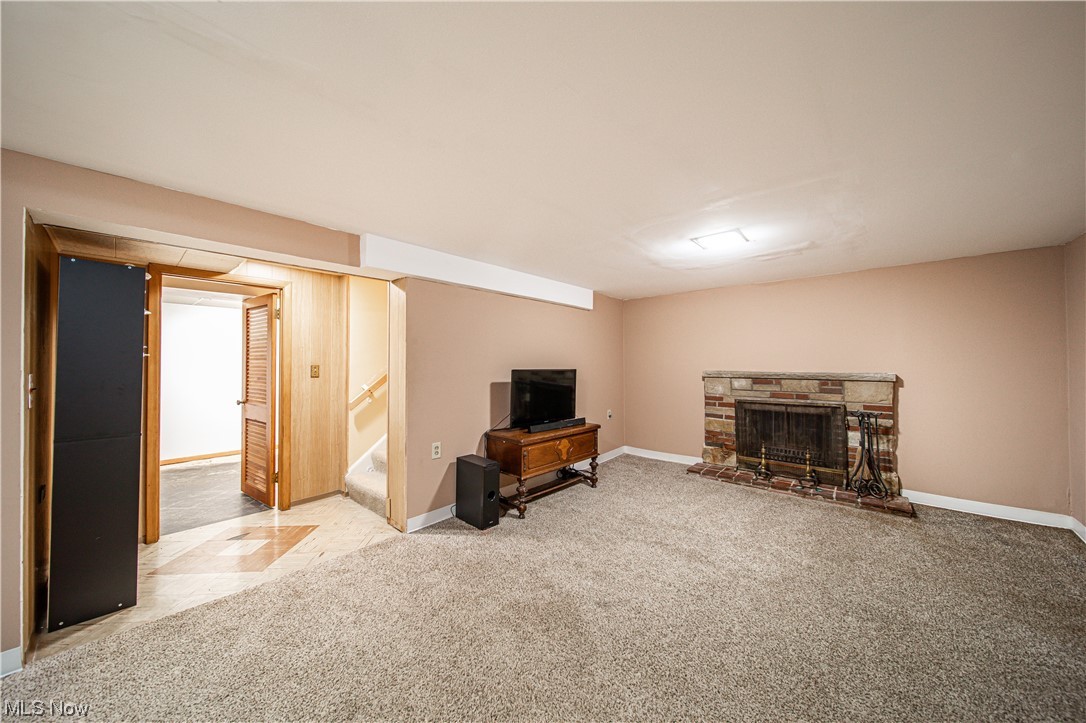 34505 Cannon Road Solon, OH 44139 - Photo 17 of 34 Living room with a fireplace and light carpet