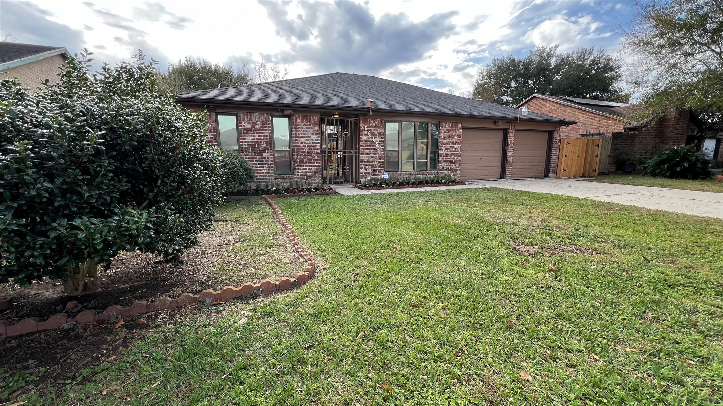 a front view of a house with garden