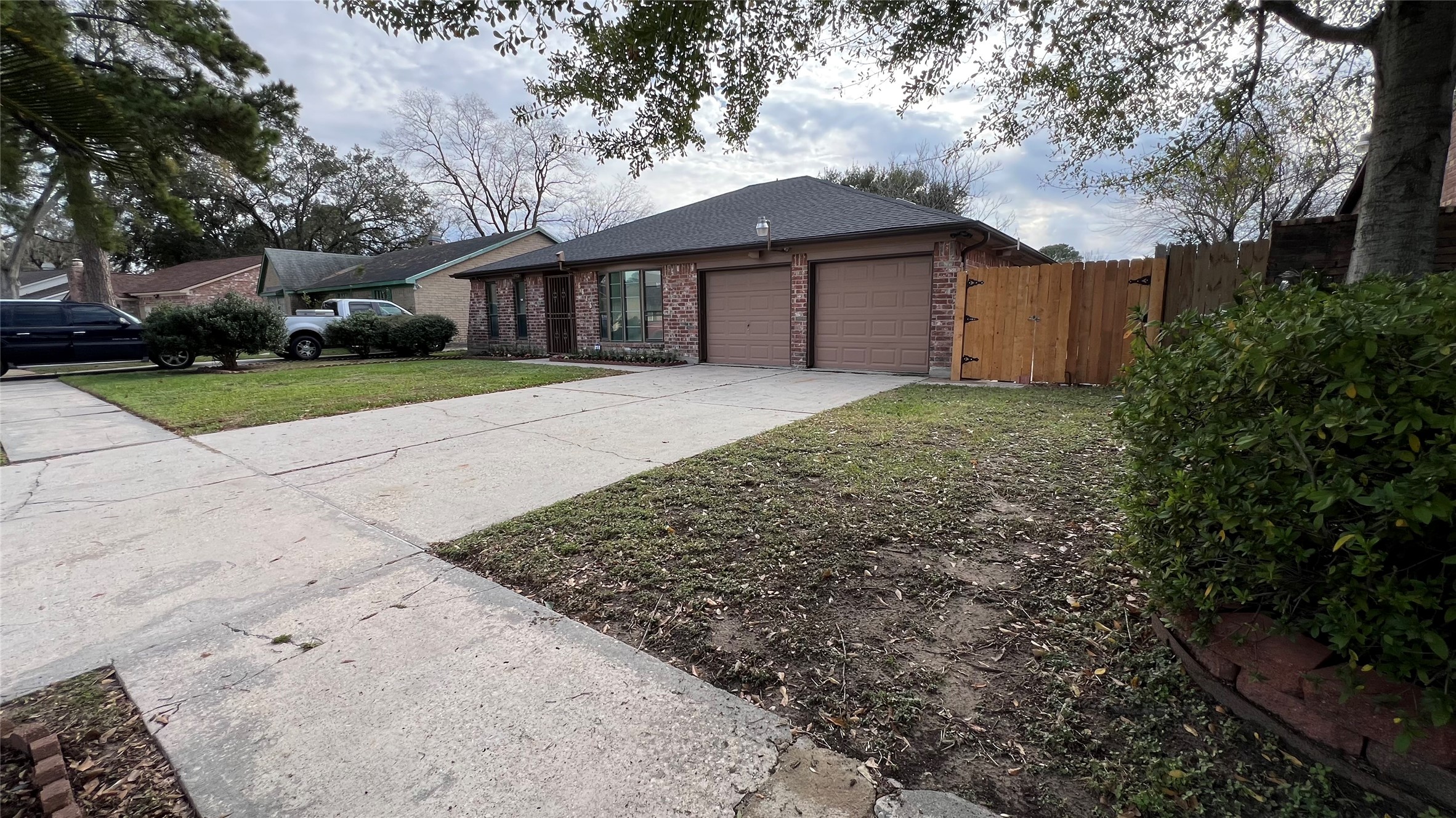 6615 Deer Ridge Lane Houston, TX 77086 - Photo 5 of 38 a front view of a house with a yard and garage
