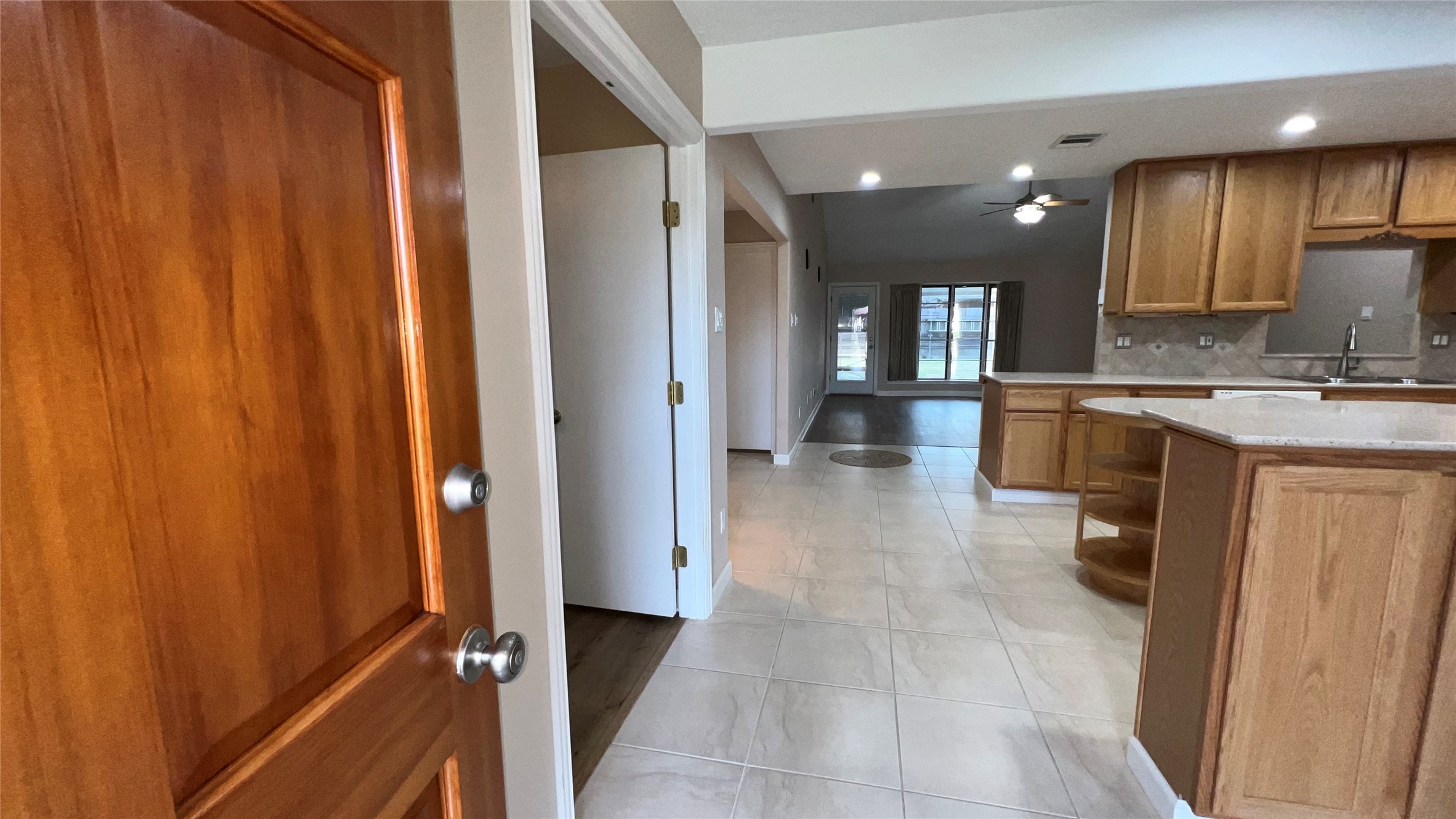 6615 Deer Ridge Lane Houston, TX 77086 - Photo 6 of 38 a view of a kitchen with kitchen island granite countertop wooden cabinets and stainless steel appliances