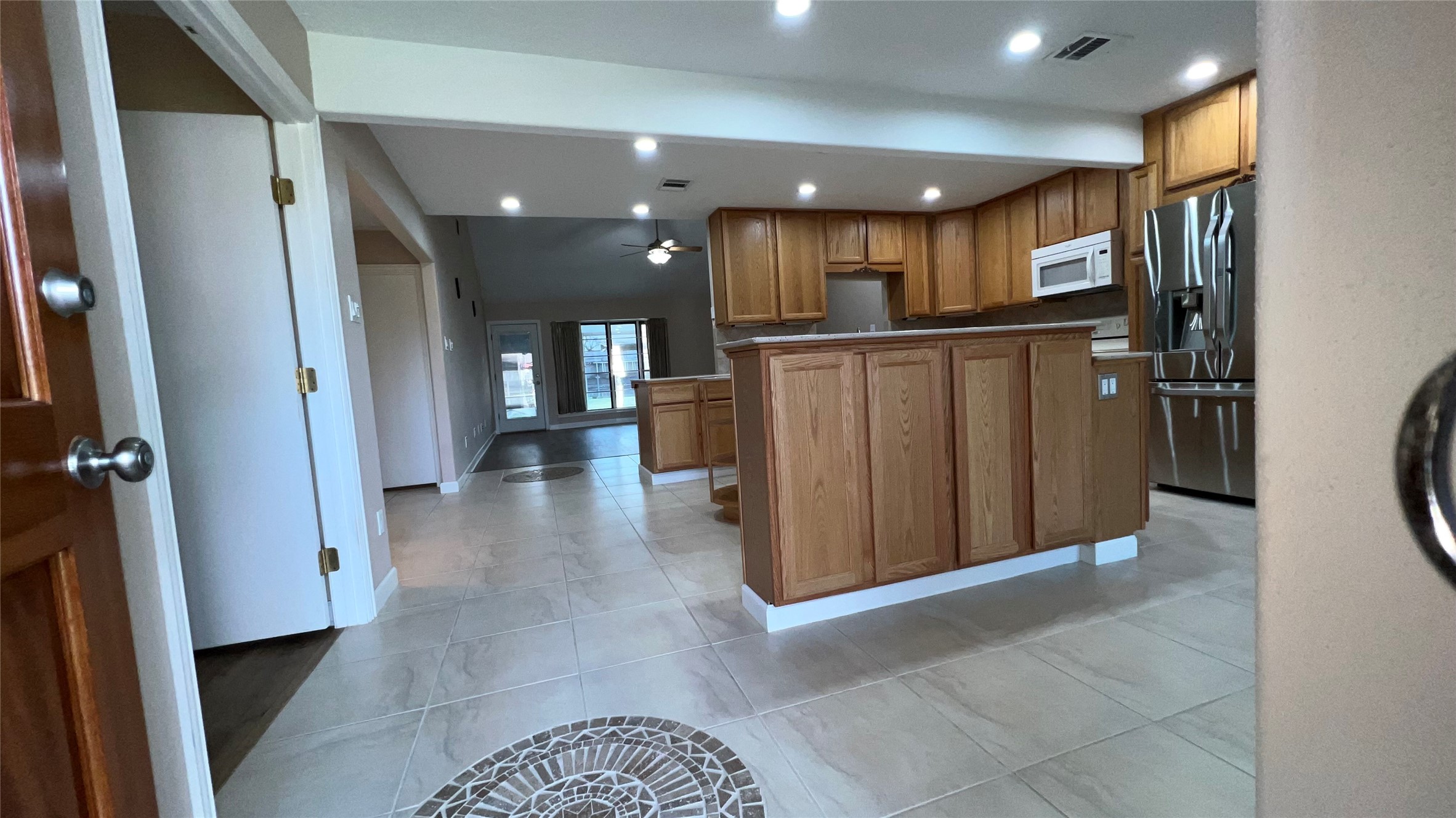 6615 Deer Ridge Lane Houston, TX 77086 - Photo 7 of 38 a view of a hallway with stainless steel appliances