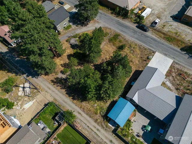 an aerial view of house with a yard