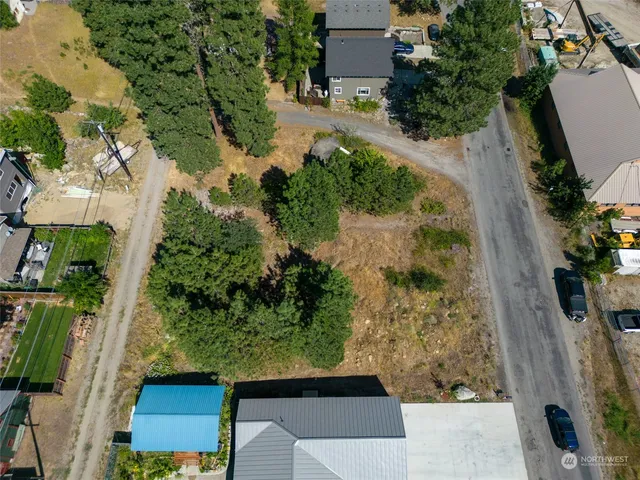 an aerial view of a house with a yard
