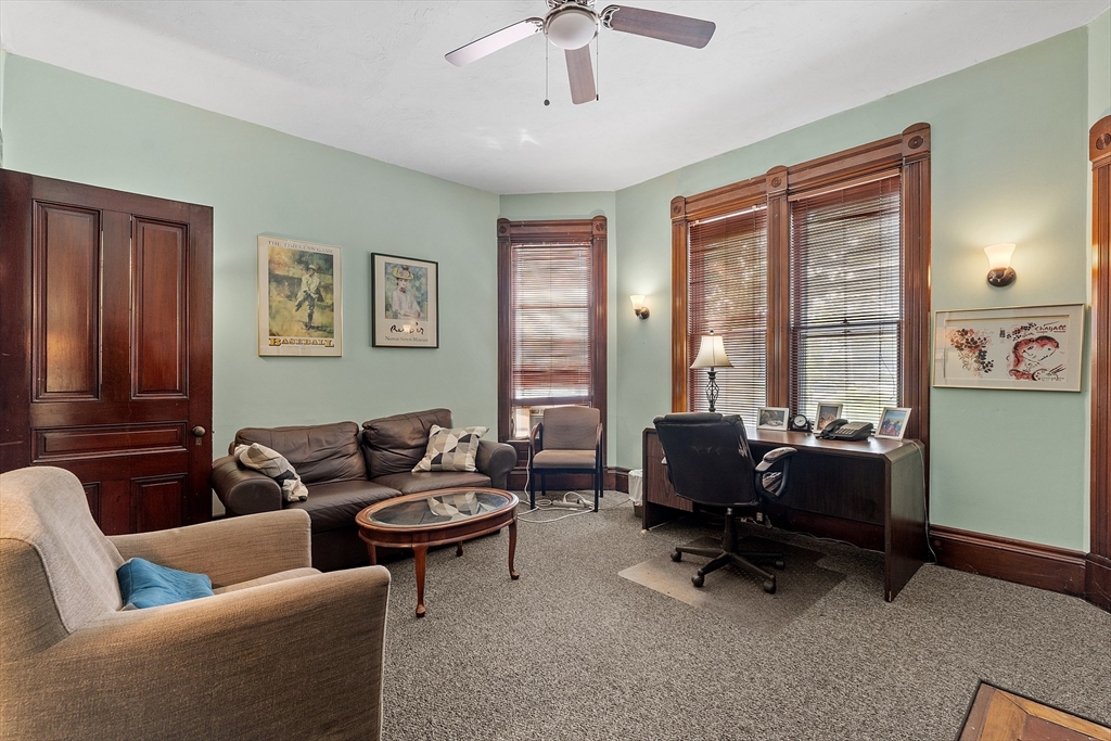 52 Cedar Street Worcester, MA 01609 - Photo 12 of 36 a living room with furniture and a window