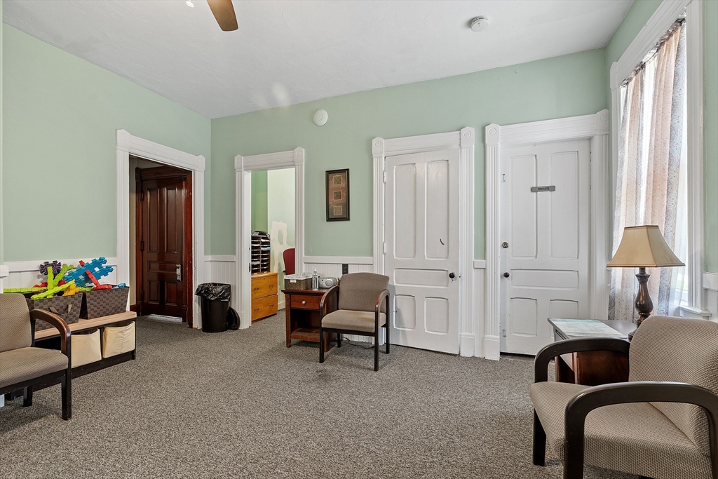 52 Cedar Street Worcester, MA 01609 - Photo 16 of 36 a living room with furniture and a lamp