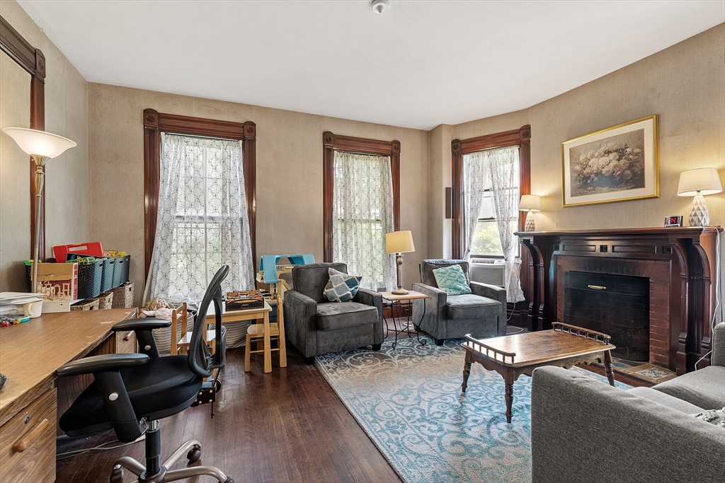 52 Cedar Street Worcester, MA 01609 - Photo 17 of 36 a living room with furniture and a fireplace