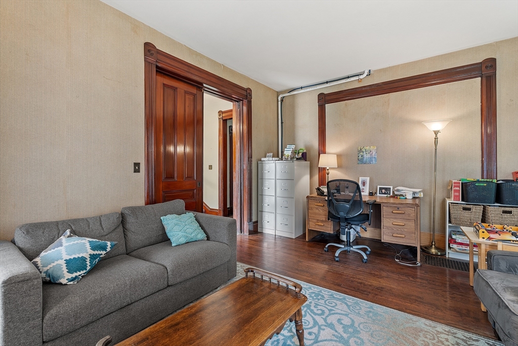 52 Cedar Street Worcester, MA 01609 - Photo 18 of 36 a living room with furniture and a flat screen tv
