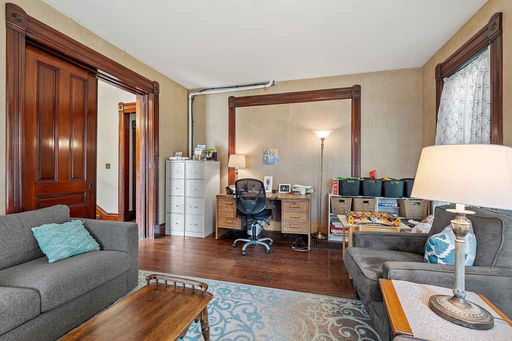 52 Cedar Street Worcester, MA 01609 - Photo 19 of 36 a living room with furniture and a window