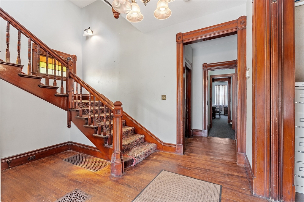 52 Cedar Street Worcester, MA 01609 - Photo 20 of 36 a view of entryway and hall with wooden floor