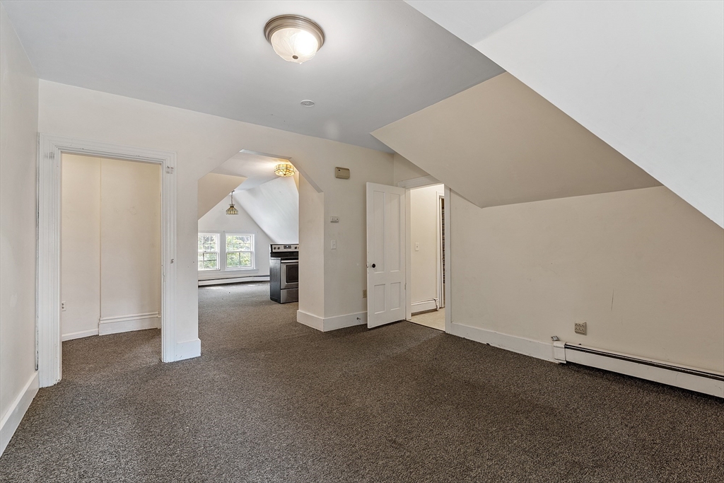 52 Cedar Street Worcester, MA 01609 - Photo 24 of 36 an empty room with a empty space and window