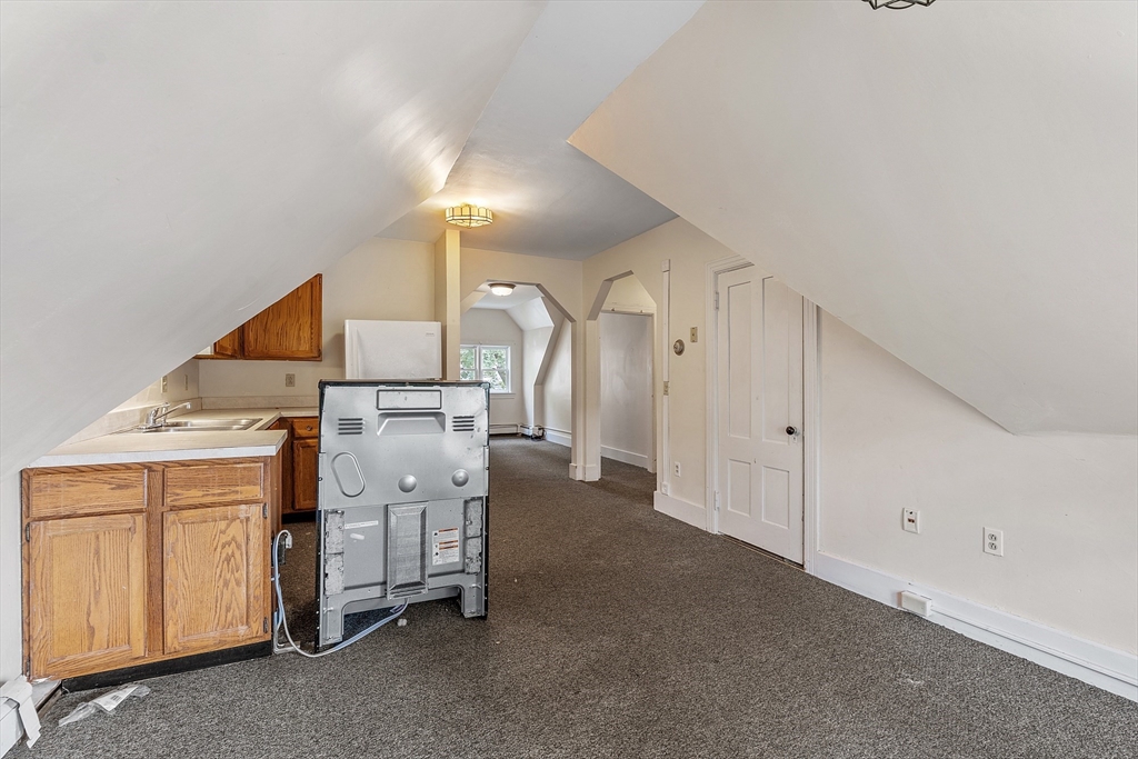 52 Cedar Street Worcester, MA 01609 - Photo 27 of 36 a utility room with cabinets