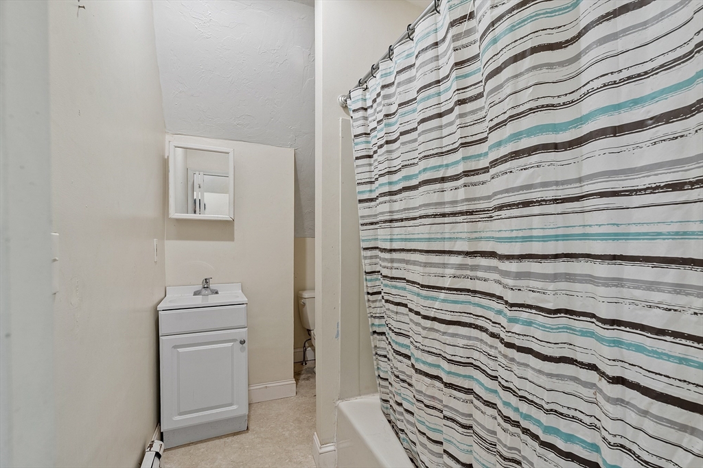 52 Cedar Street Worcester, MA 01609 - Photo 29 of 36 a bathroom with a sink and a mirror