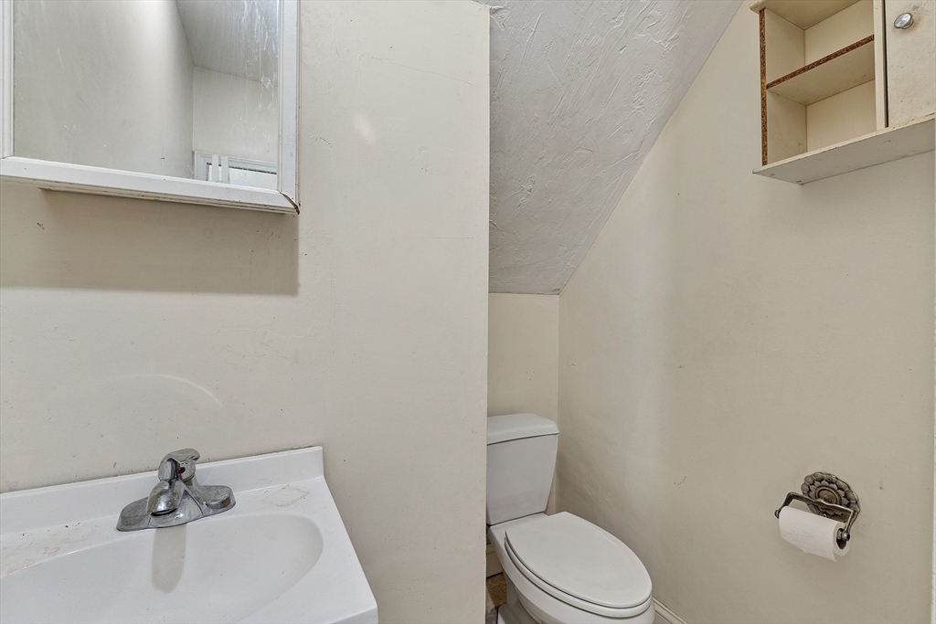 52 Cedar Street Worcester, MA 01609 - Photo 30 of 36 a bathroom with a sink a toilet and a tub