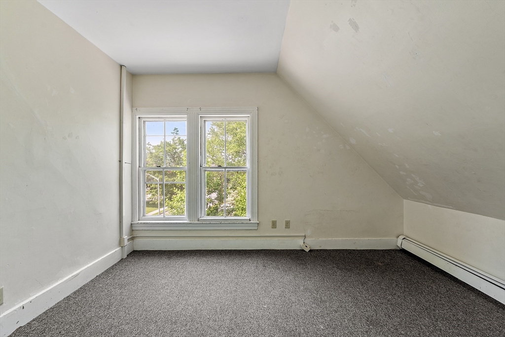 52 Cedar Street Worcester, MA 01609 - Photo 31 of 36 an empty room with a window