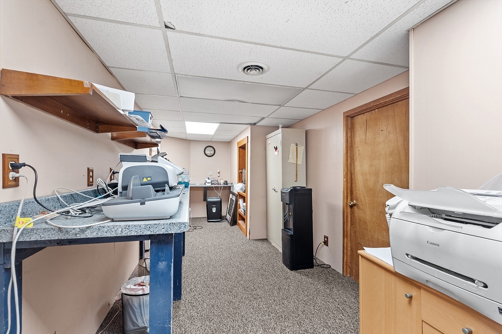 52 Cedar Street Worcester, MA 01609 - Photo 34 of 36 a kitchen with refrigerator and stove