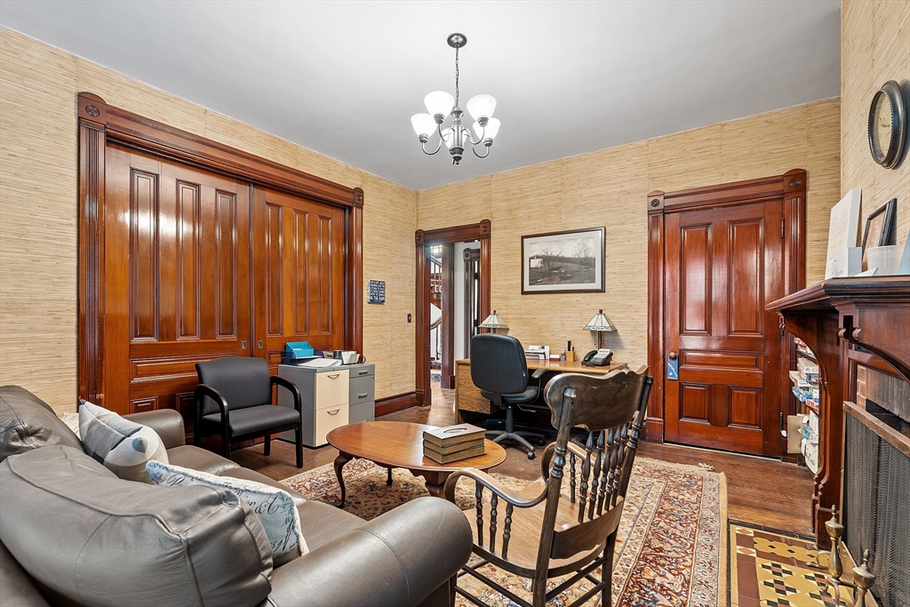 52 Cedar Street Worcester, MA 01609 - Photo 8 of 36 a living room with furniture a chandelier and a window
