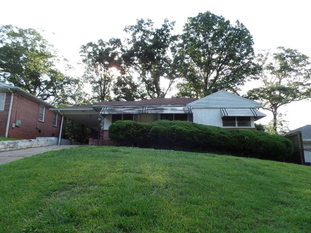 2190 Springdale Road Southwest Atlanta, GA 30315 - Photo 1 of 1 a front view of a house with a garden and yard