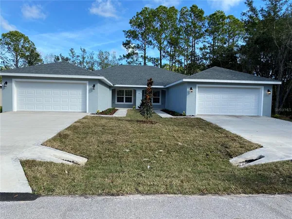front view of a house with a yard