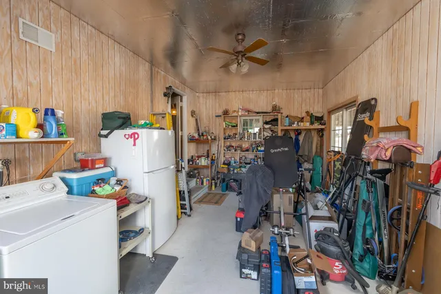 a room with pool table and windows