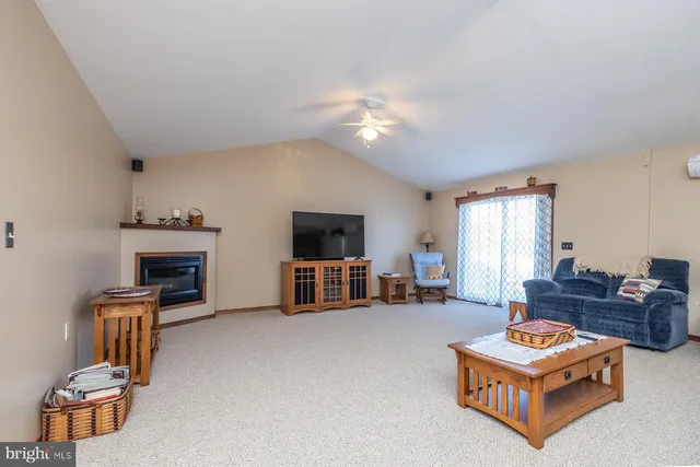 a bed room with furniture and a fireplace