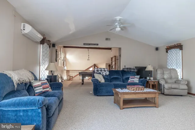 a bedroom with a bed dresser and a window