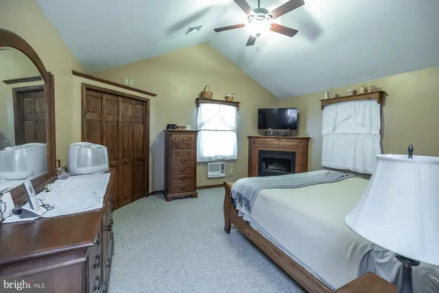 a view of a patio with table and chairs under an umbrella