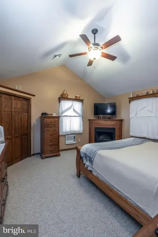 a front view of a house with a yard outdoor seating and barbeque oven