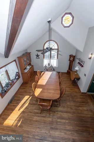 a view of a balcony dining area with furniture