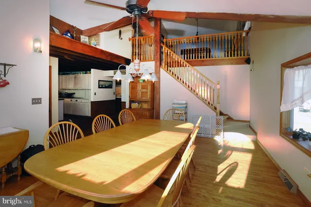 a kitchen with stainless steel appliances granite countertop a stove a sink dishwasher and a refrigerator