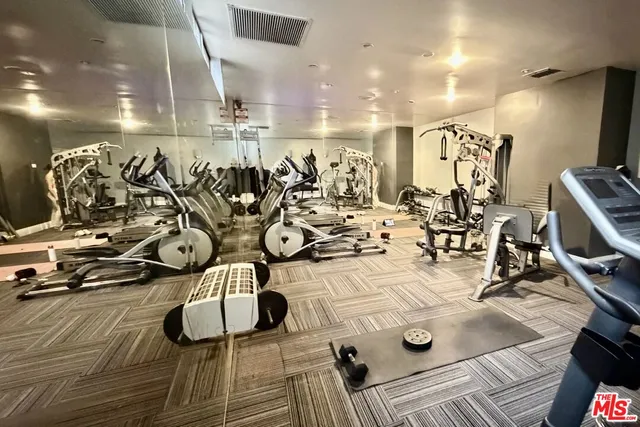 a view of a porch with a table and chairs